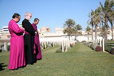 Dr Anis, Dr Williams and Dr Musk pray at Commonwealth War Graves Cemetery