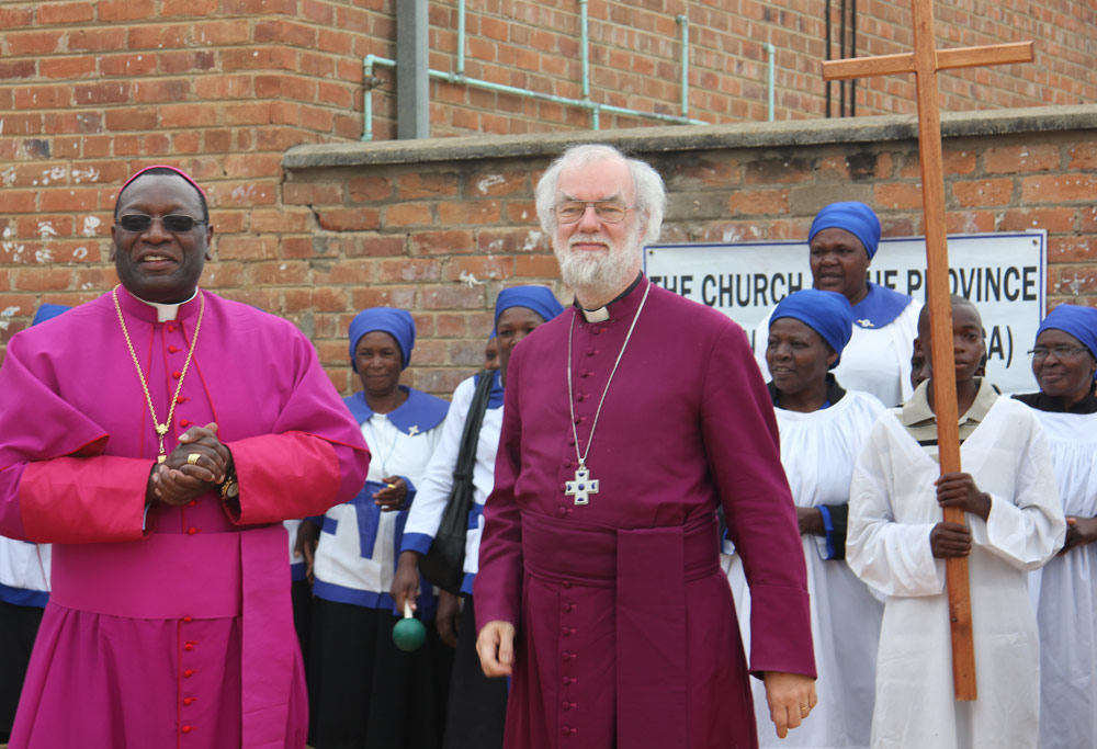 Members of the displaced congregation in Rusape with Archbishop Rowan and Bishop Julius Makoni