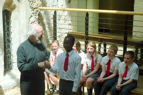 Archbishop and pupils sing Happy Birthday to Success 