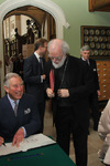 Prince Charles signs the visitors' book at Lambeth Palace Library