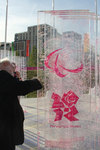 Archbishop Rowan signs the Truce Wall at the Olympic Village