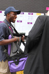 Archbishop Rowan examines a Sweet Treats box at the London 2012 Paralympic Games