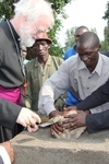 The Archbishop and Bishop William laying a foundation stone in Boga